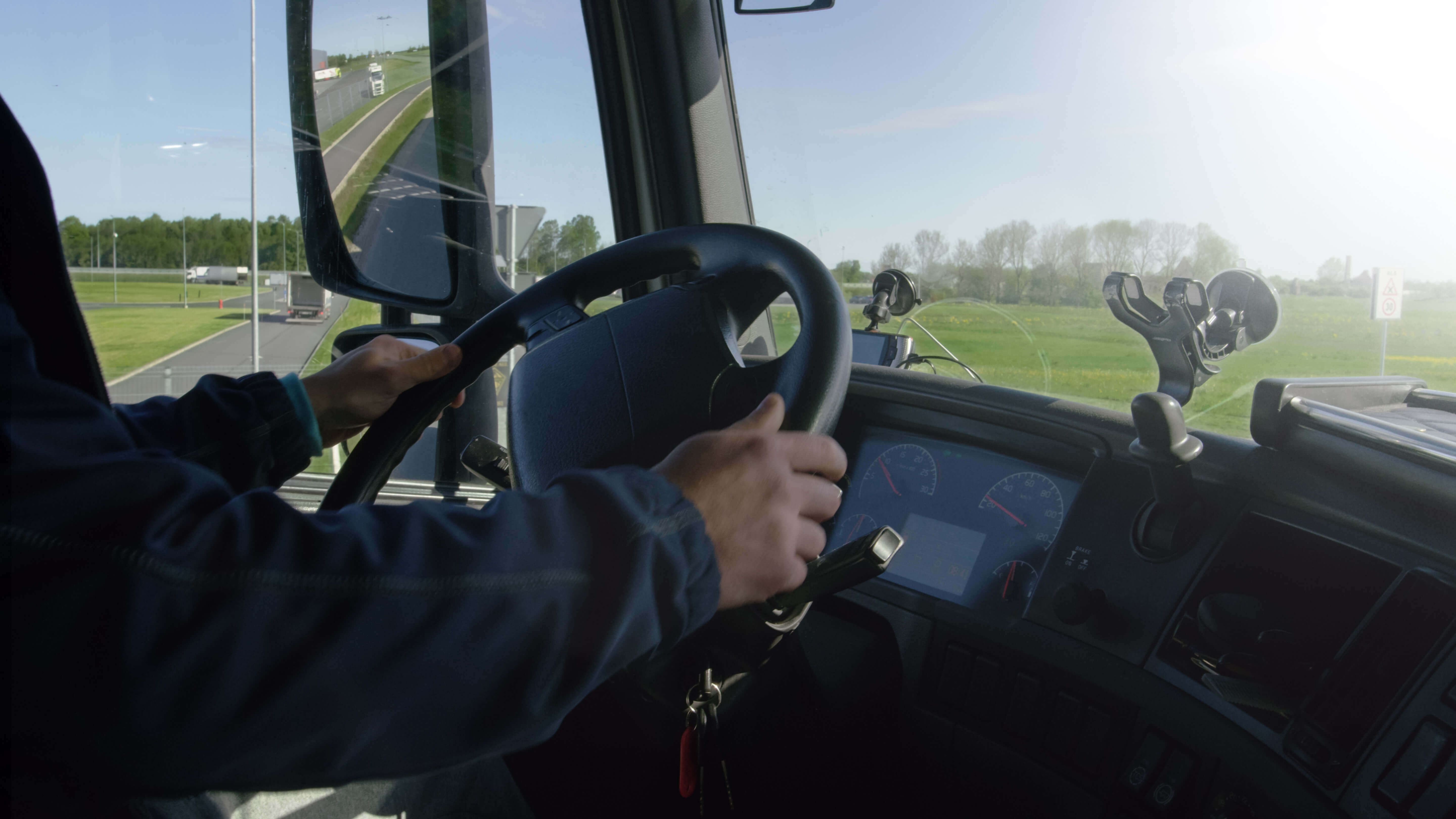Driver hands on wheel